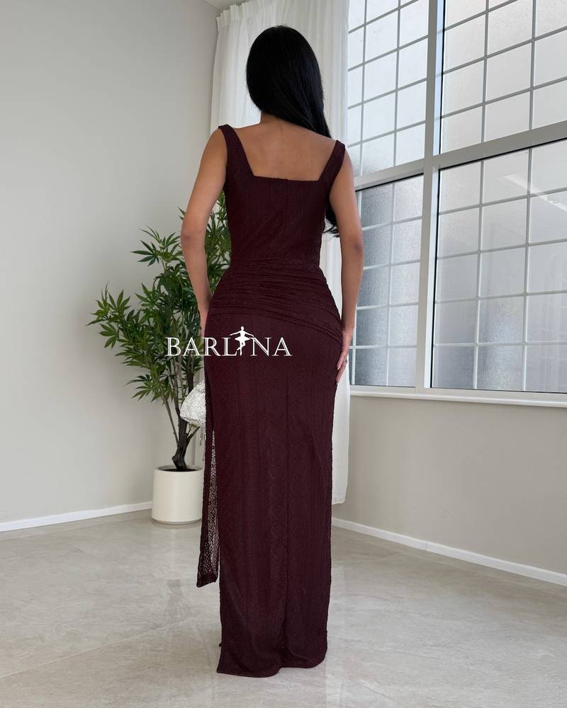 A luxurious burgundy draped lace dress