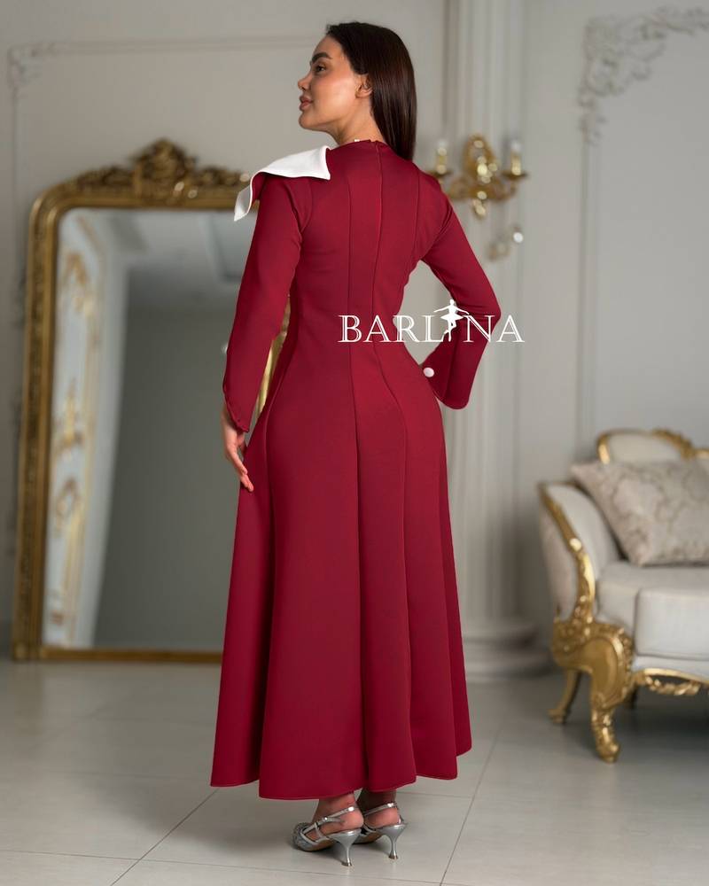 Red flared dress with an asymmetrical neckline