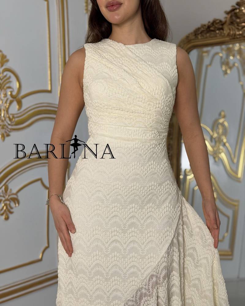 Off-white sleeveless dress with an asymmetrical cut