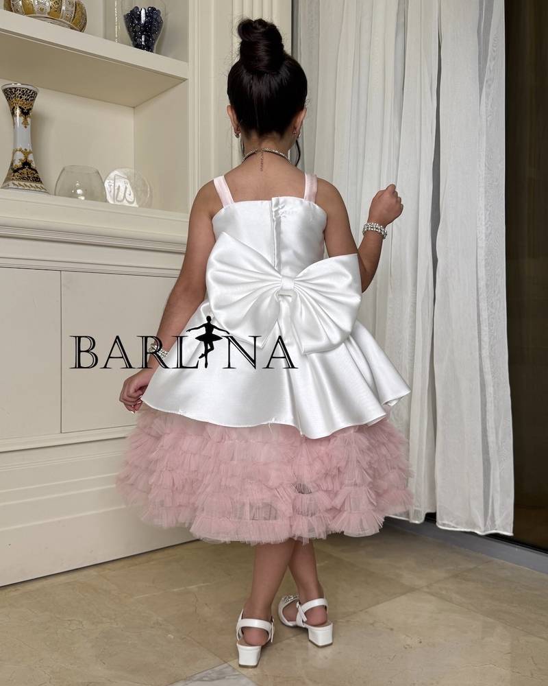 Girls' white dress with prominent flowers and ruffles