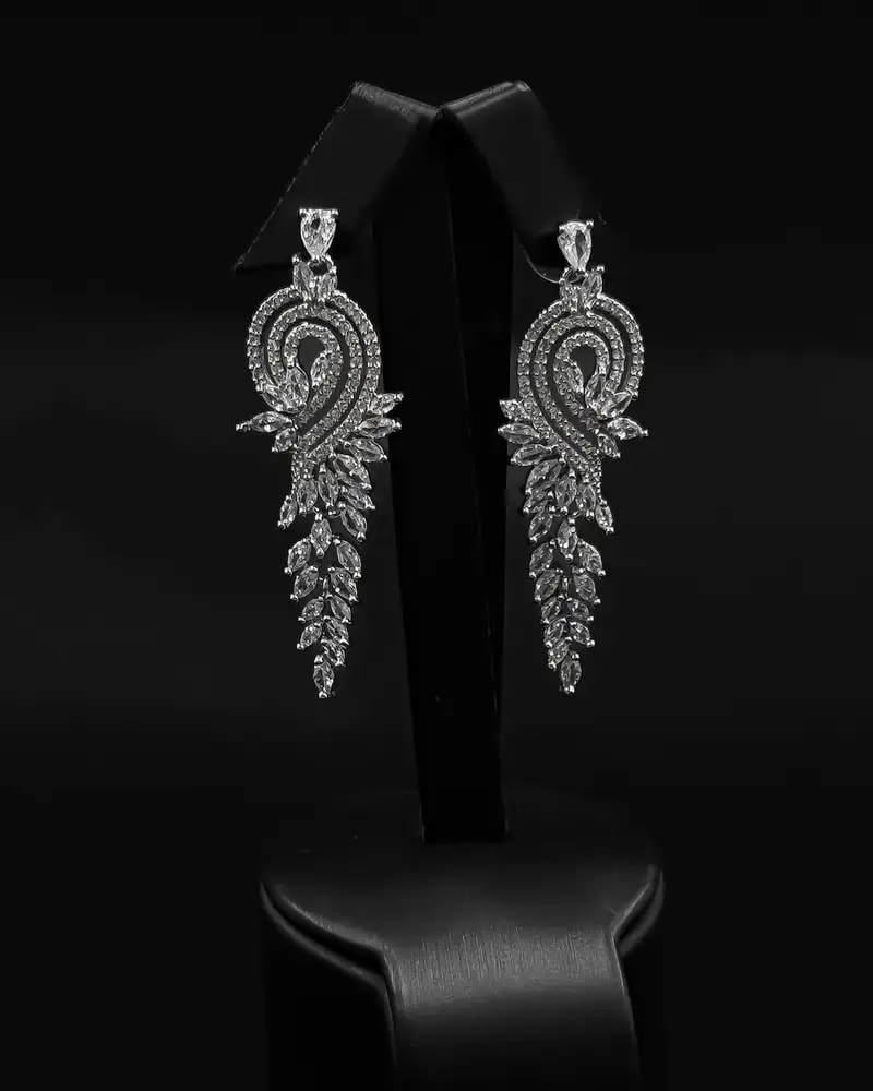 Luxurious long earrings with a flowing ornate design