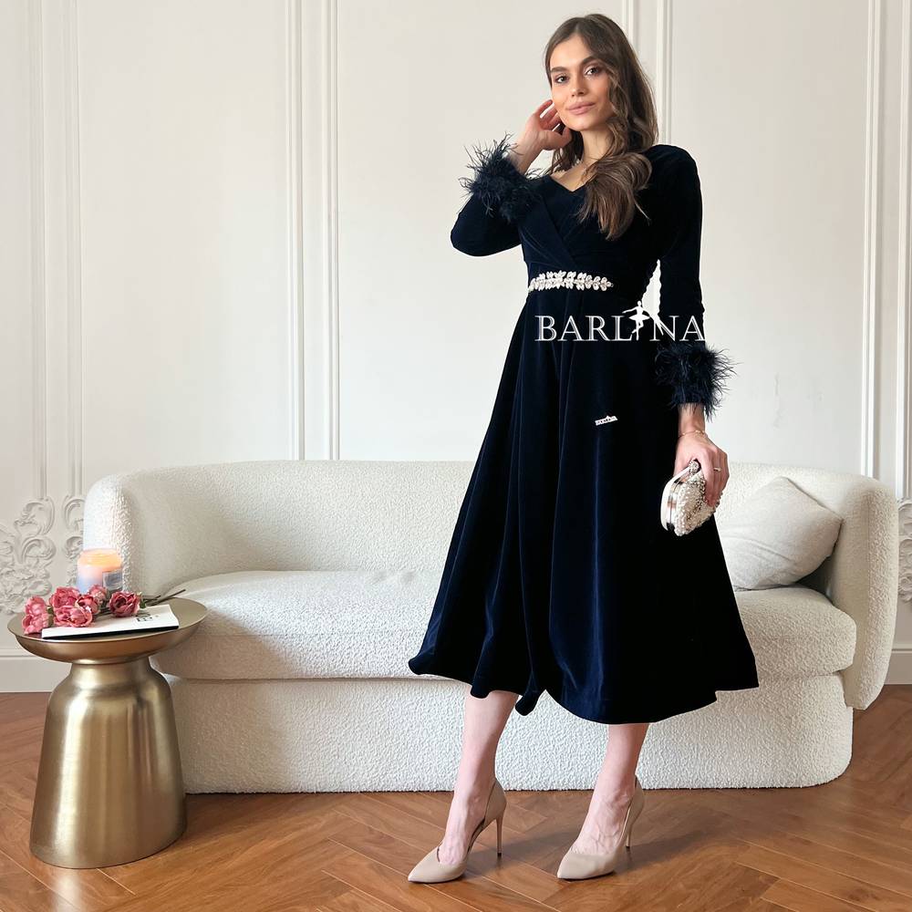  navy blue velvet dress with feathers