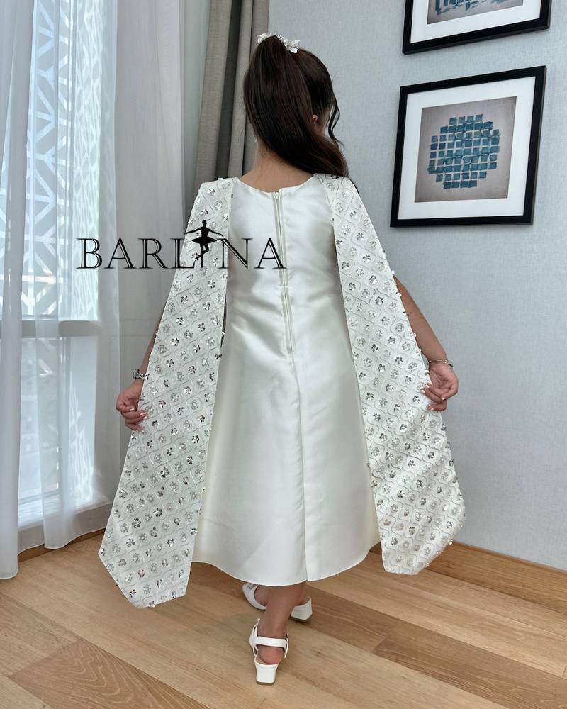 Girls' white dress with a large embroidered bow