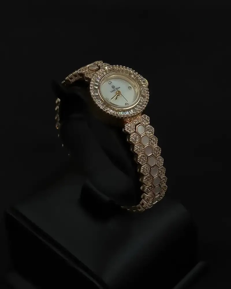 A luxurious women's watch adorned with sparkling stones