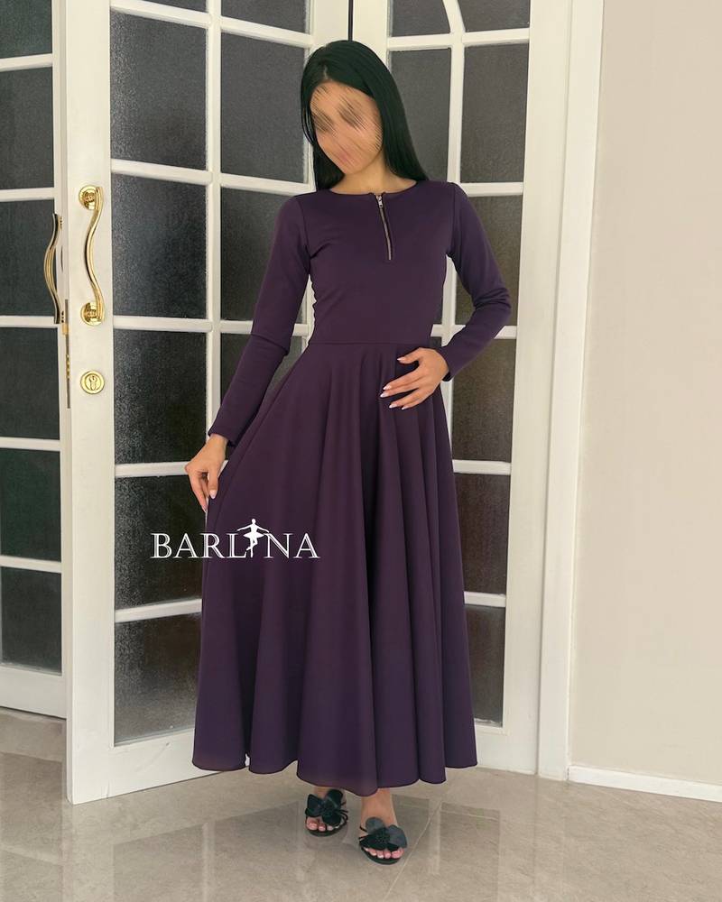A dark purple dress with an elegant and soft design