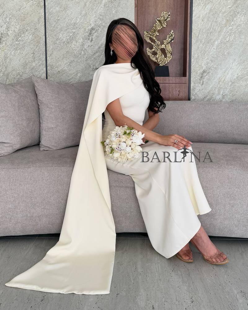 White one shoulder dress with draped fabric
