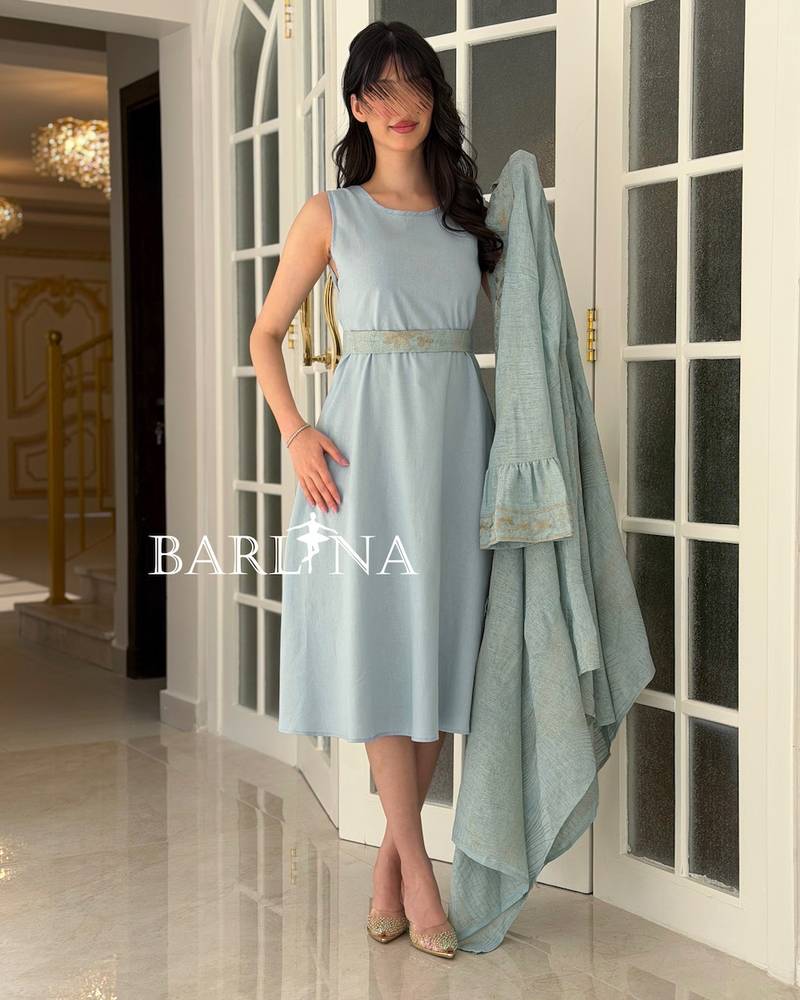 A soft jalabiya with an outer abaya featuring a gold pattern
