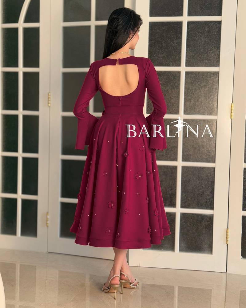 A stylish fuchsia dress with delicate embroidery
