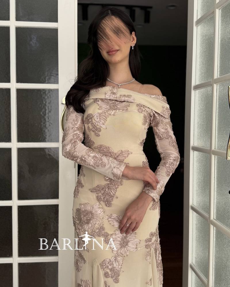 Elegant beige dress with delicate embroidery and a floral pattern