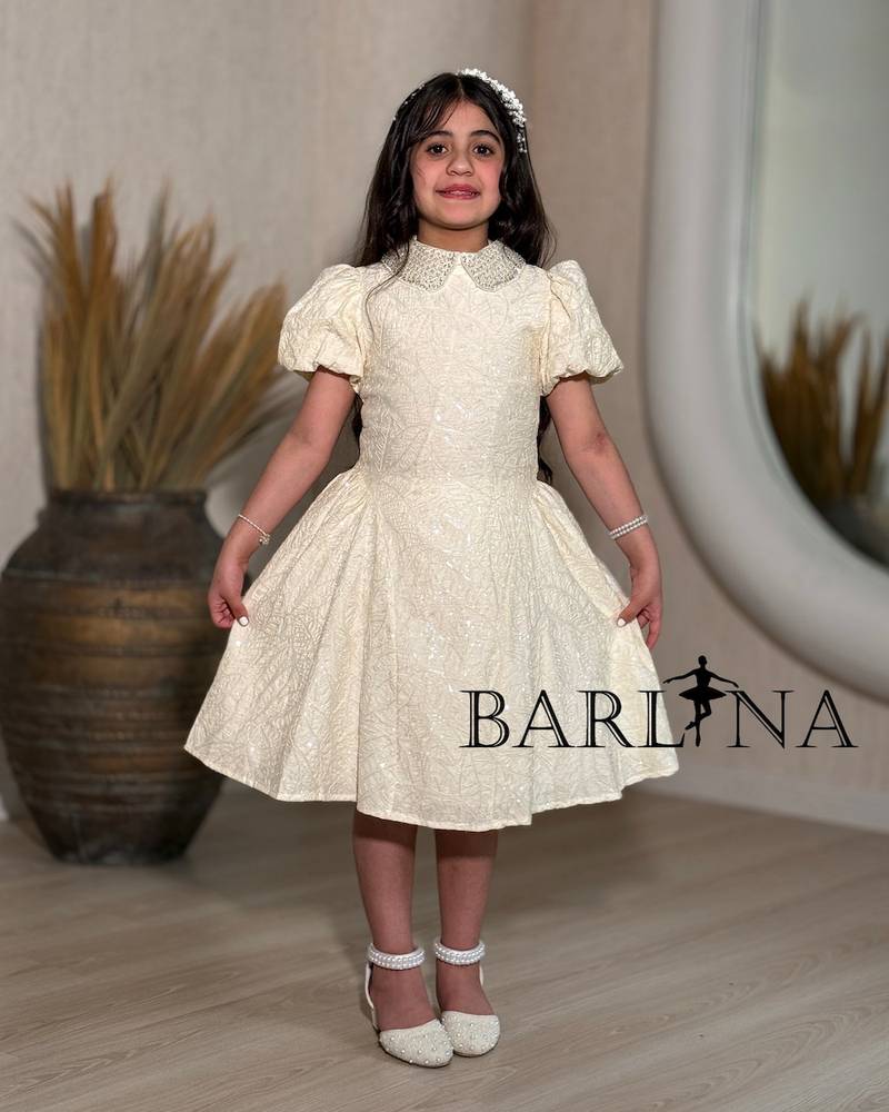 Beige girls' dress with a glittery embellished fabric