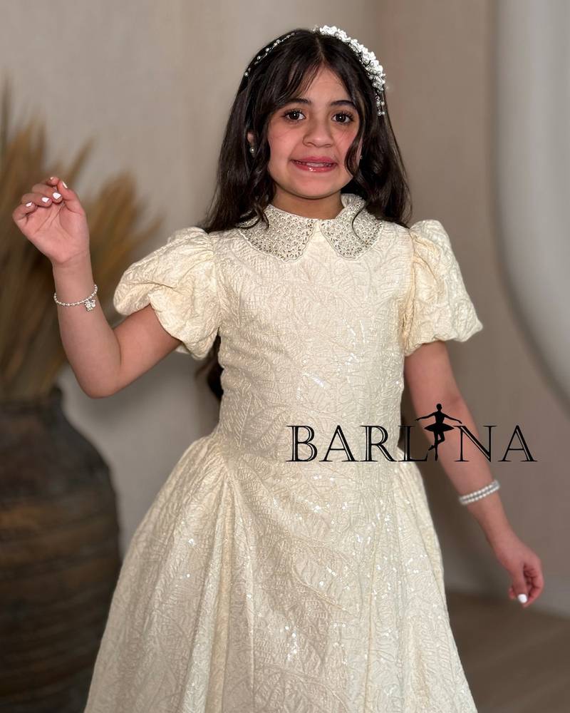 Beige girls' dress with a glittery embellished fabric