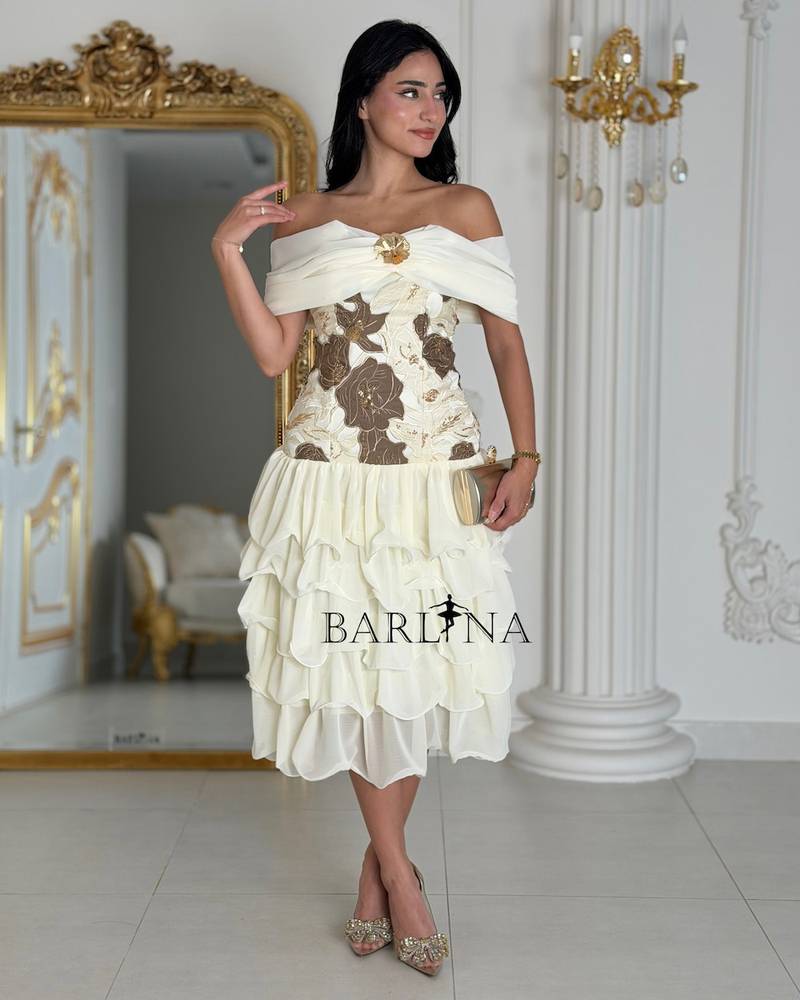 Off white midi dress with an off the shoulder design