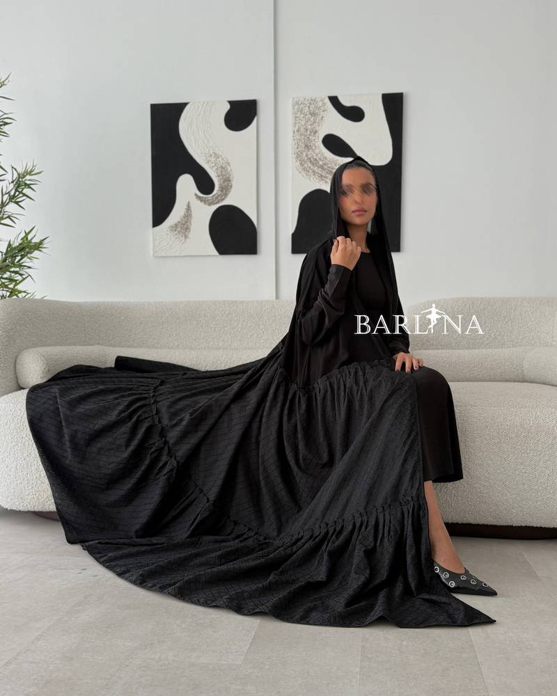 Elegant black abaya with patterned fabric