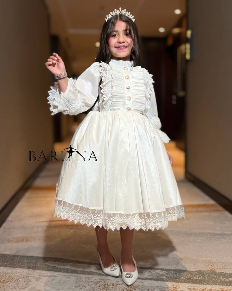 Off-white girls' dress with front ruffles