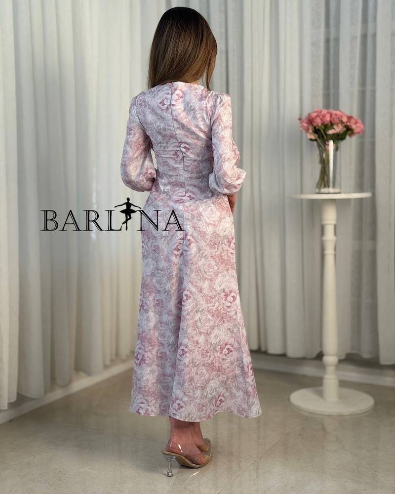 A pink dress with delicate floral patterns