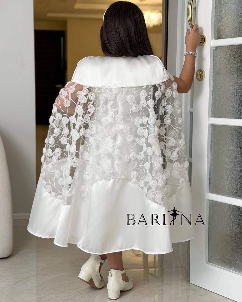 White dress with a lace cape and delicate embroidery
