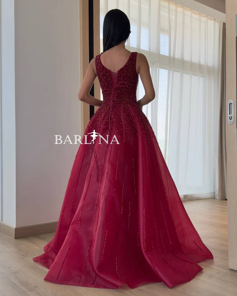 Burgundy evening dress embroidered with shiny beads