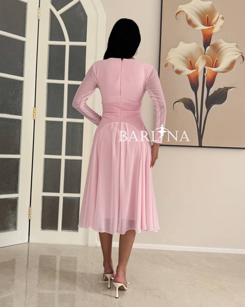 A light pink dress with soft and simple details