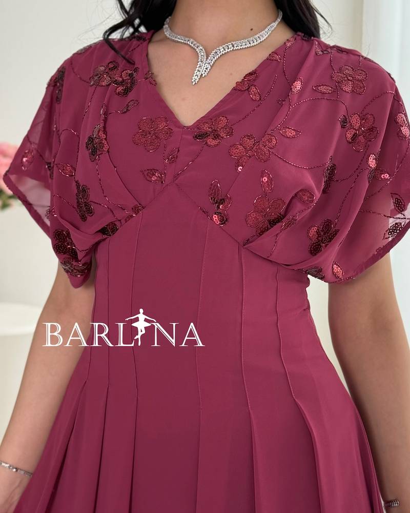 Fuchsia pleated dress with sequined roses