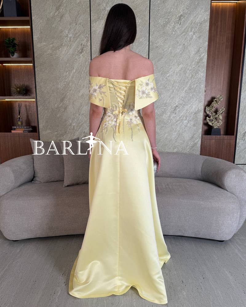 Yellow off-shoulder dress with delicate embroidery