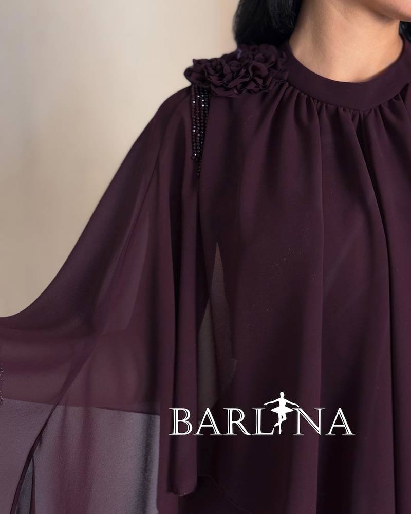 vinous wide dress with layers and cape sleeves