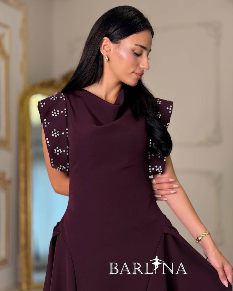 Maroon dress with embroidered shoulders and a flared silhouette
