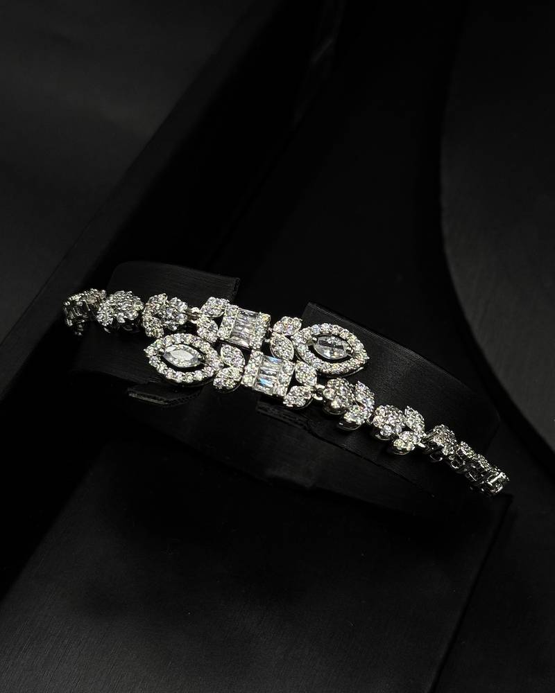 An evening accessory set intricately adorned with diamonds