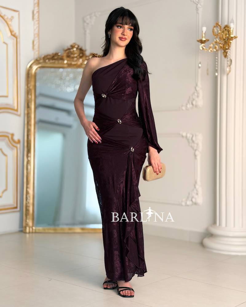 A soft, fitted dress adorned with elegant metallic details.