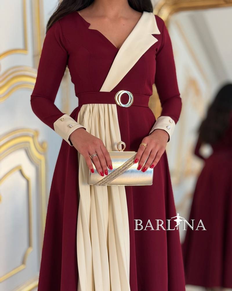 Burgundy dress with side pleats and an elegant belt