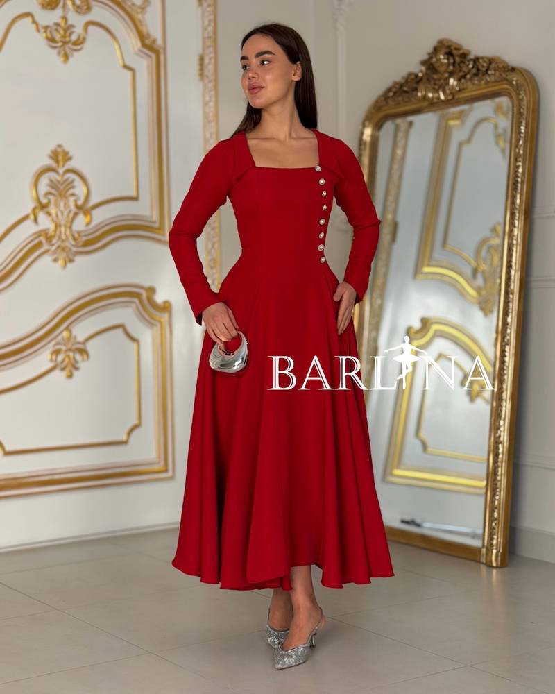 Red dress with a straight cut and pearl side buttons