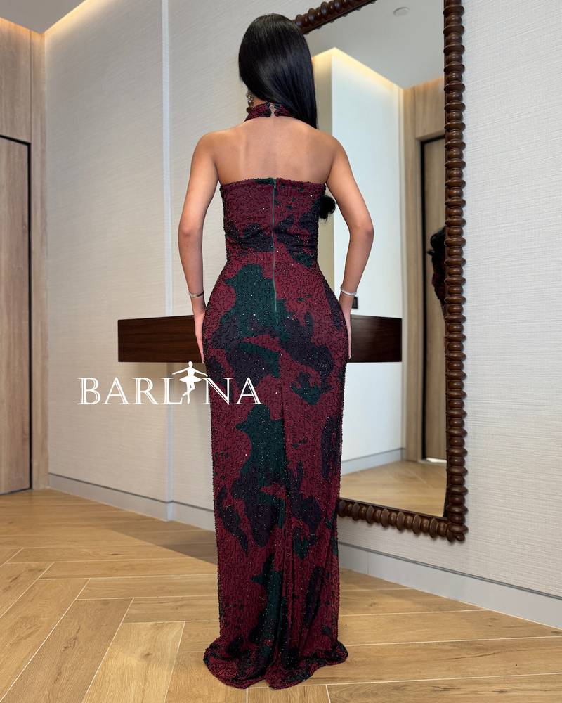 Black dress embroidered with red intertwined patterns