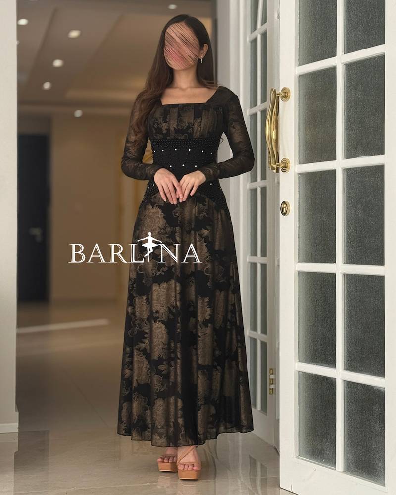 Long black dress with a dark floral pattern