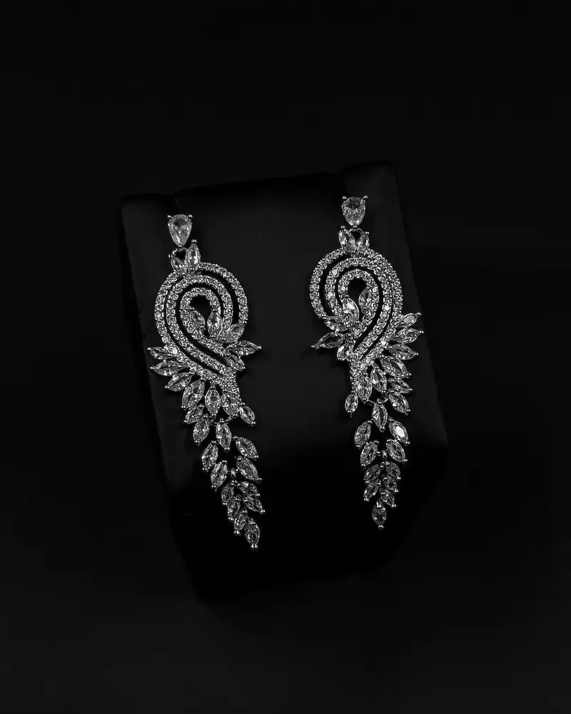Luxurious long earrings with a flowing ornate design