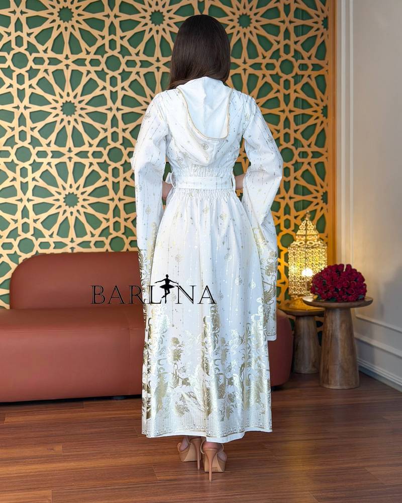 White jalabiya embroidered with gold and with flowing sleeves