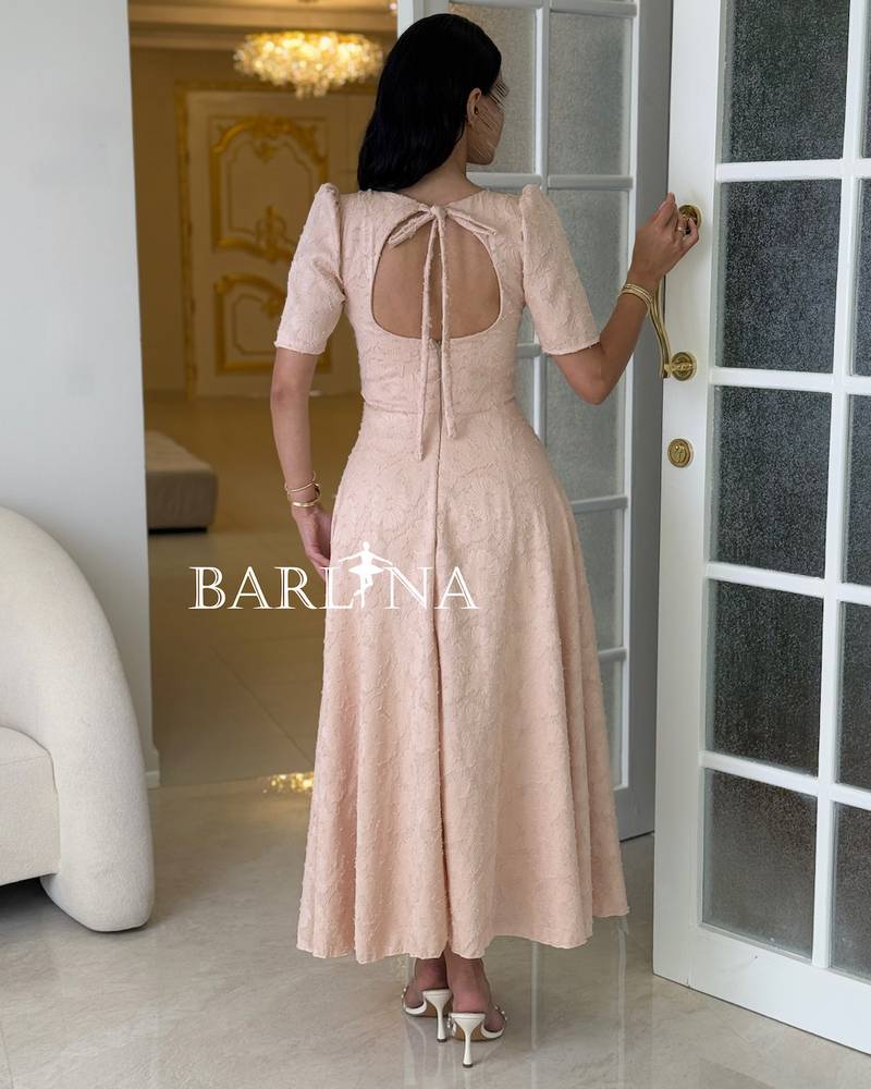 Light beige dress embroidered with delicate lace