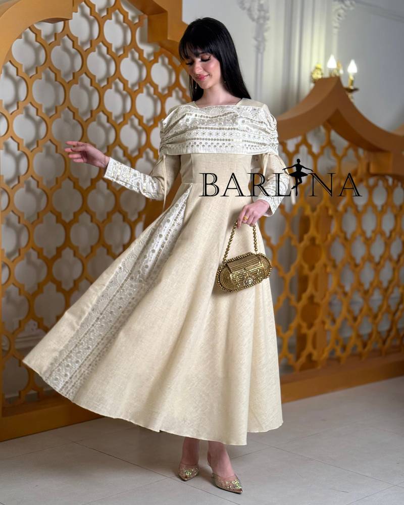 Soft off-white jalabiya with elegant traditional embroidery