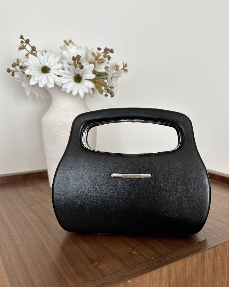 Leather handbag with a practical handle