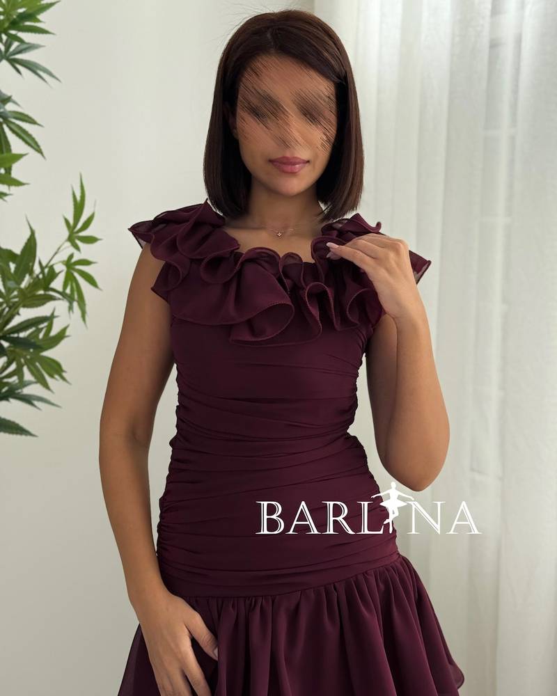 Burgundy dress with a ruffled collar and tiered layers