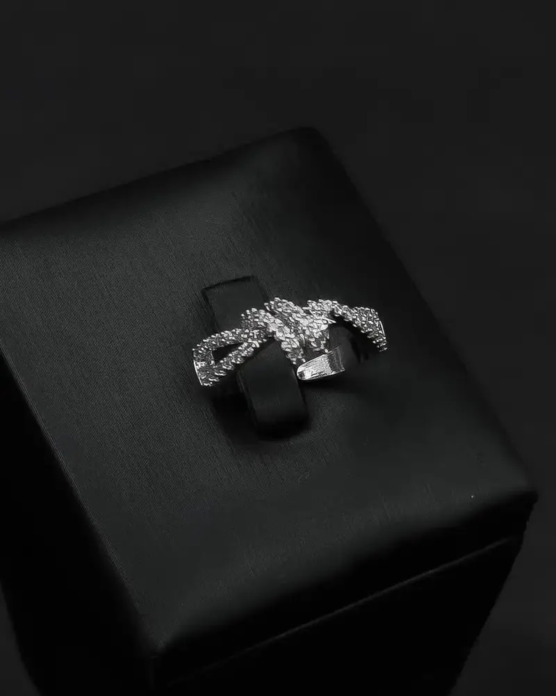 A bracelet and ring with a delicate design and prominent details.