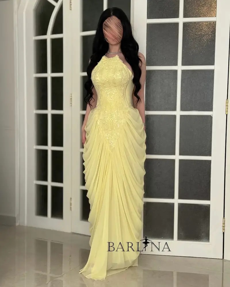 Yellow dress with delicate embroidery and ruffle details