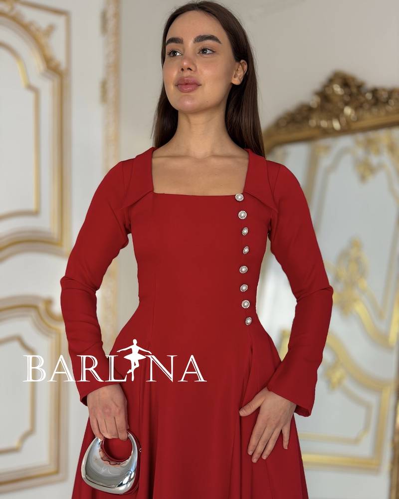 Red dress with a straight cut and pearl side buttons