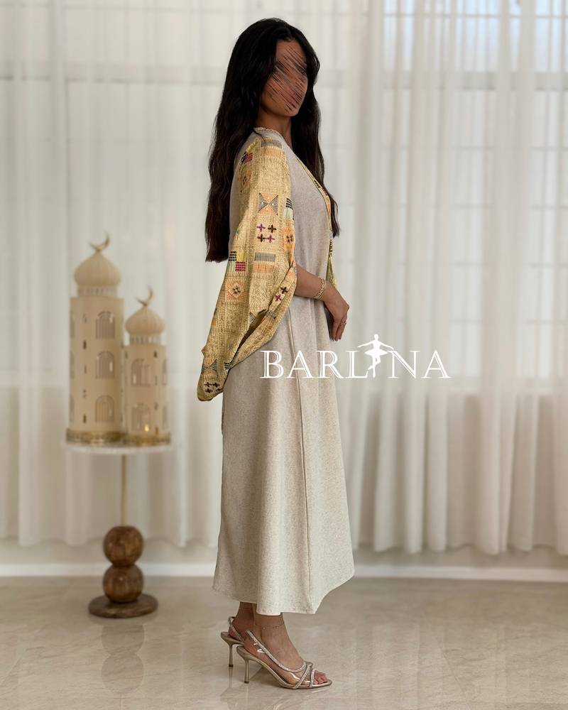 Beige jalabiya with delicate embroidery details at the top