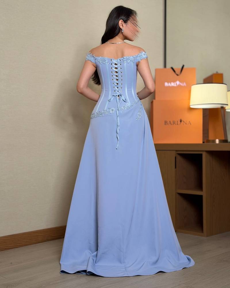 Draped evening dress with a fitted corset silhouette