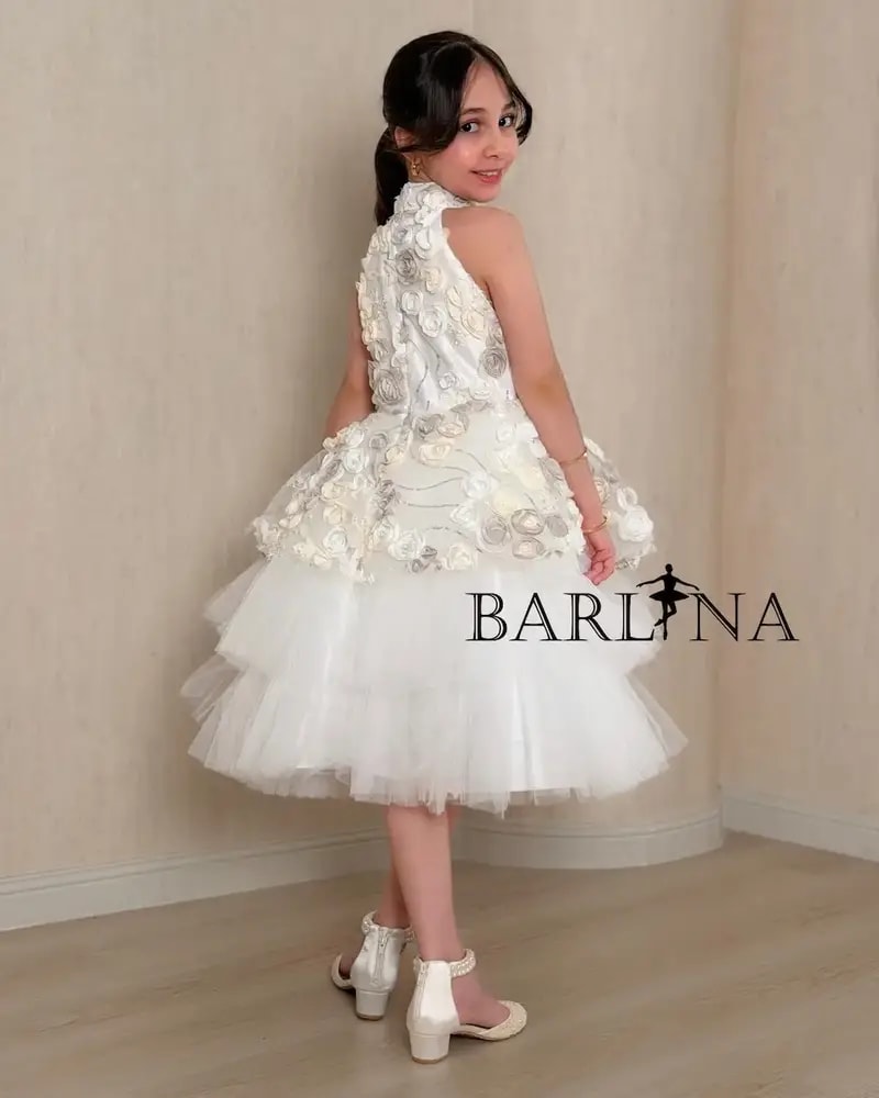 White girl's dress with prominent roses and fluffy tulle