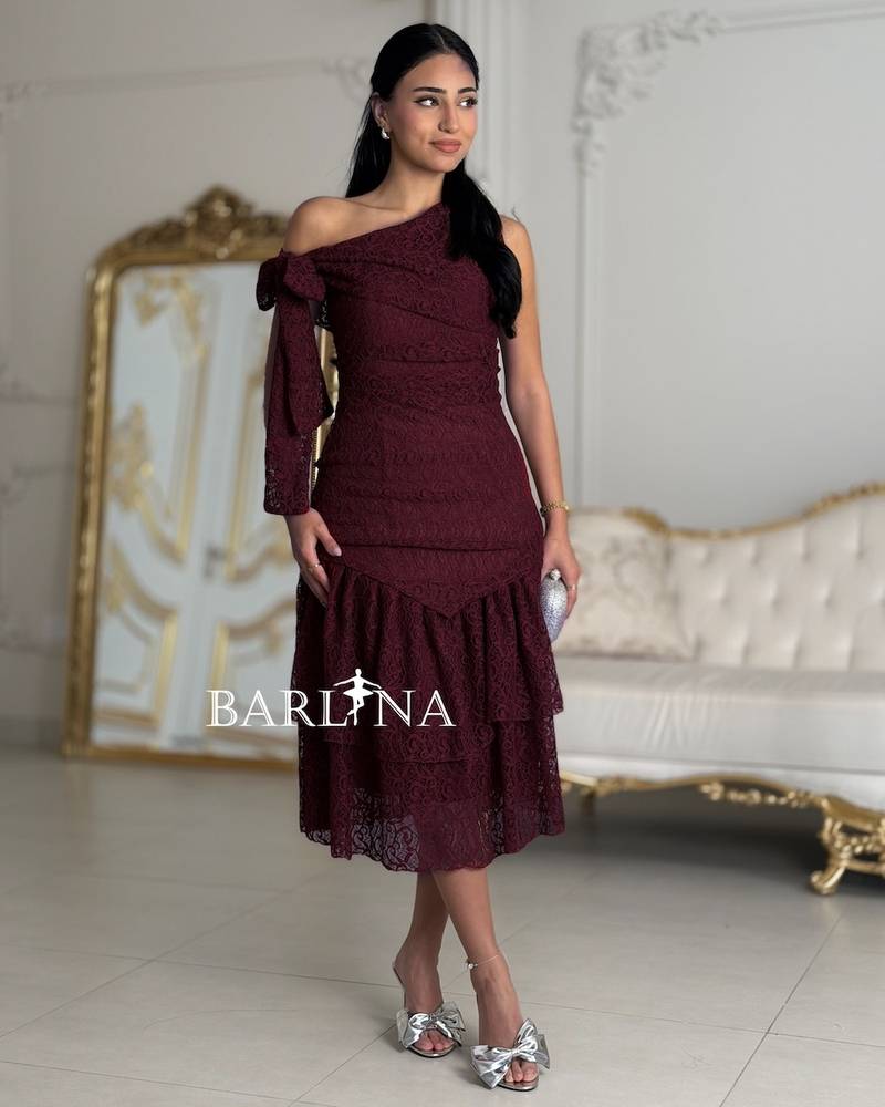 A dark burgundy dress made of fine lace
