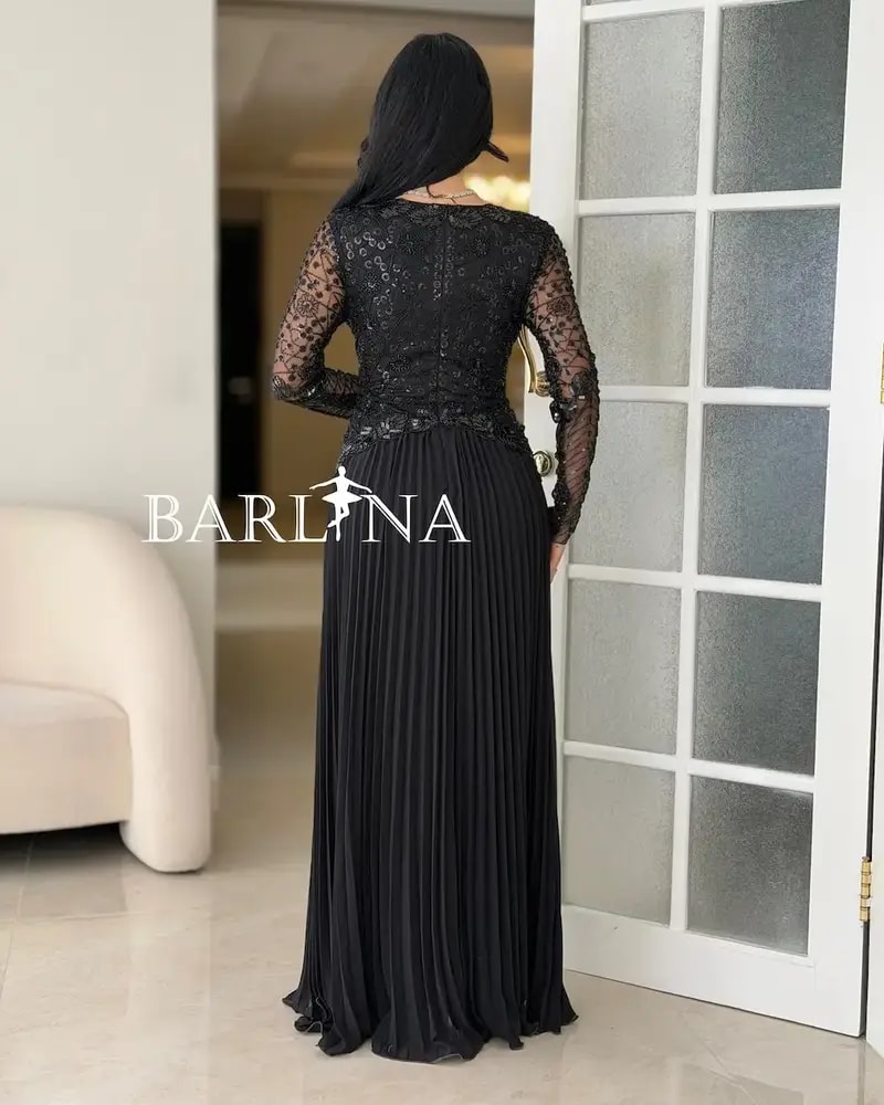 Luxurious black dress with embroidery on the top