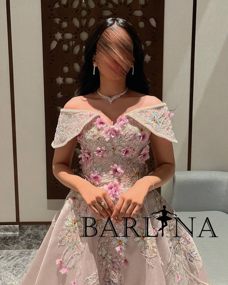 Pink evening dress decorated with elegant beads and embroidery