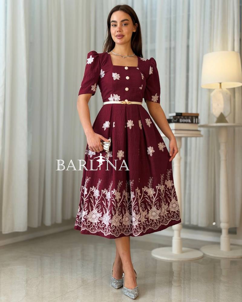 Burgundy midi dress adorned with white embroidery