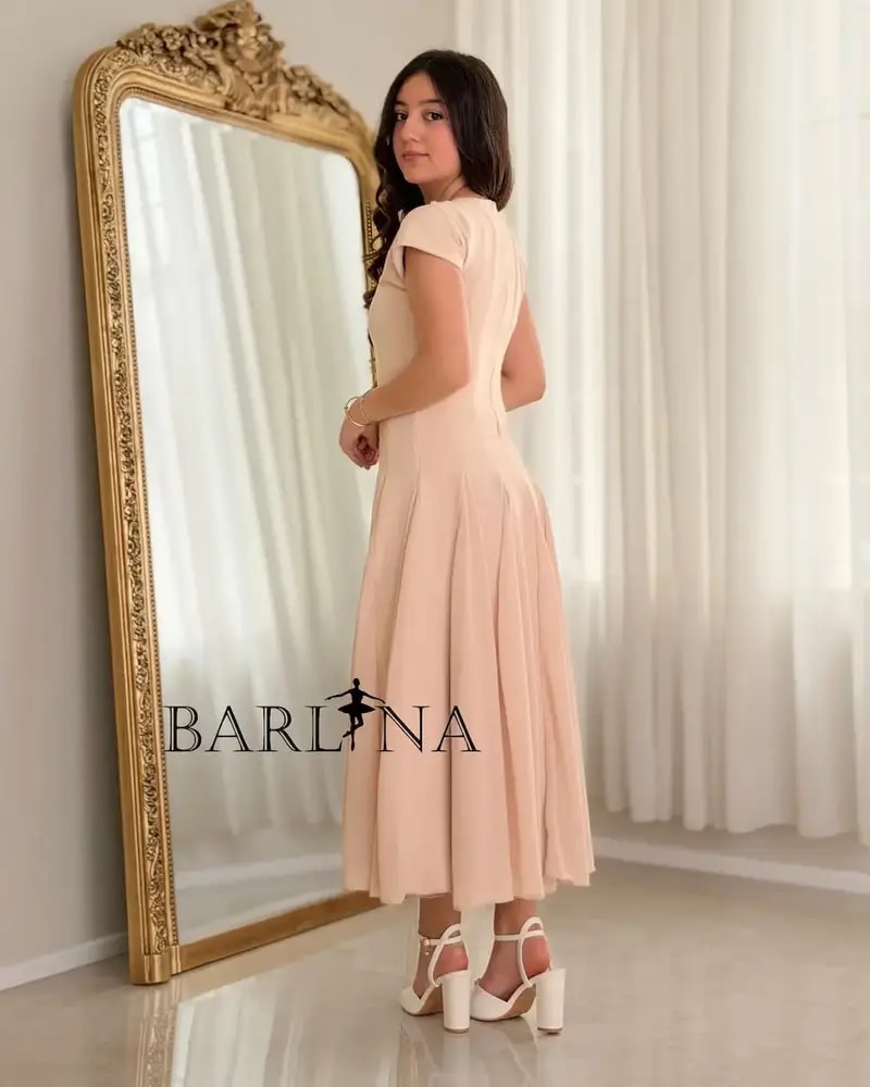 Elegant nude dress adorned with pearl details