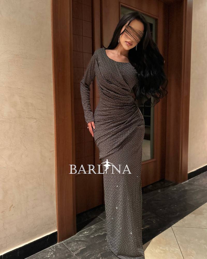 Long, fitted dress with delicate embroidery